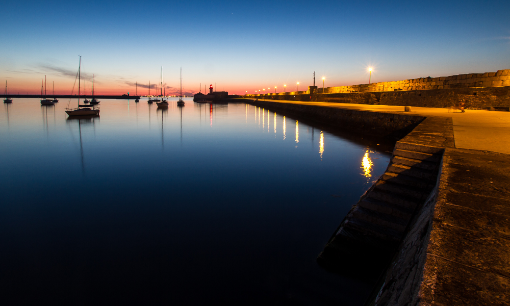 A view of the sea and harbour at nighttime at Dun Laoghaire 