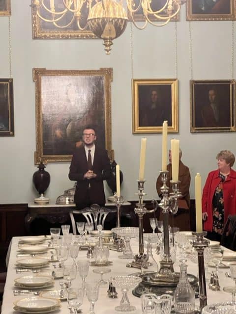 From left to right - in pic 1 you see the curator addressing the guests. In the front is the banquet table with candle stands and Irish crystal. In the second and third pic you can see a shell like table ornament that also had a utility and functional value. In the fourth pic you see crystal glassware. All of this is a part of The Great Hall at Malahide Castle. 