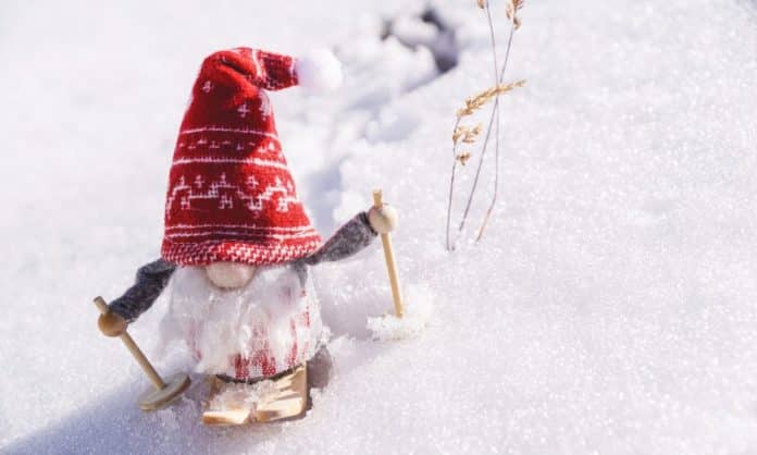 A tiny snowman for Christmas - he is sliding across the snow