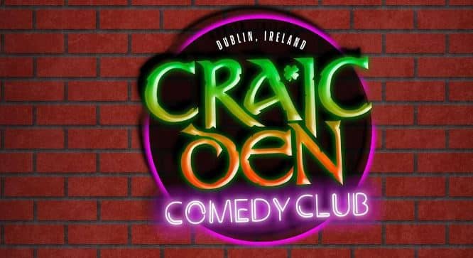 A poster in red (brick wall) and green and pink about Craic Den's Comedy Club