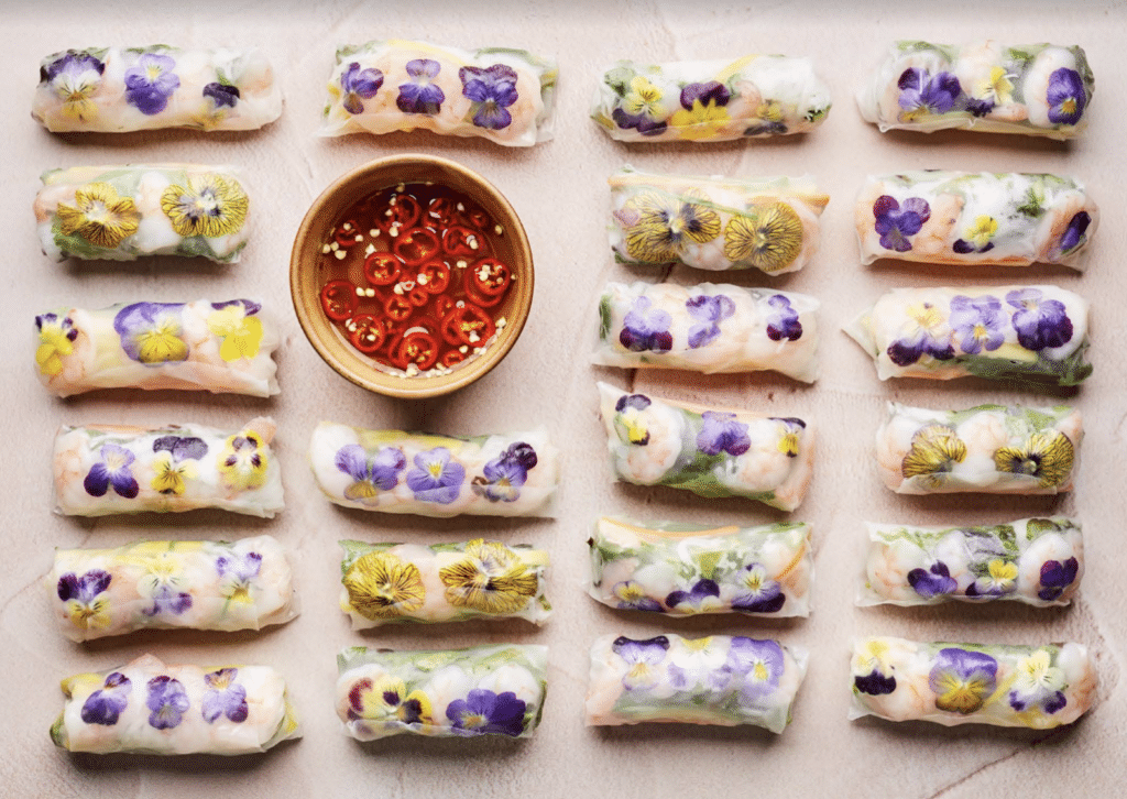 Vietnamese Spring Rolls arranged on a board; from The Edible Flower