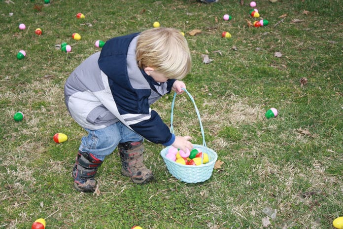 Child with an Easter basket and Easter eggs